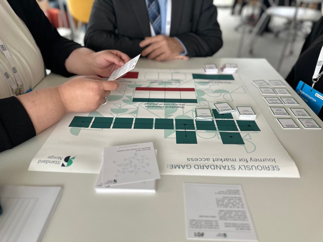 Participant holding a card while playing the Seriously Standard Game